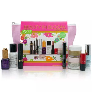 A variety of cosmetic items including makeup, skincare products, and a pink cosmetic bag.