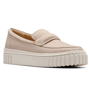 A beige loafer with a thick, textured sole and slip-on design, featuring a sleek upper and padded lining.