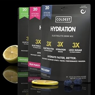 Boxes of Coldest Hydration electrolyte drink mix in Watermelon and Fruit Punch flavors with sliced citrus fruit in front.