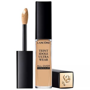 Lancôme Teint Idole Ultra Wear all-over concealer with applicator wand, featuring black cap and golden logo on base.