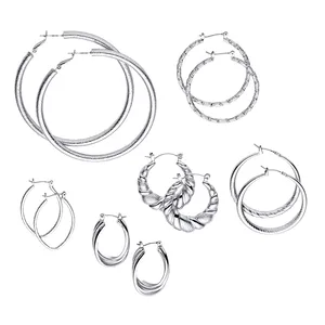 A collection of silver hoop earrings in various designs and sizes, including twisted and textured patterns.