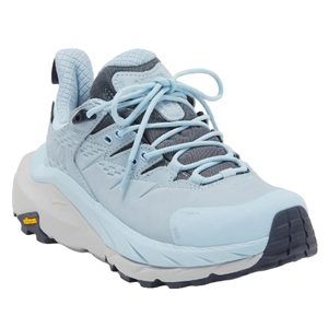 Light blue Hoka Women's Kaha Trail Shoes with a cushioned sole, lace-up design, and Vibram outsole for traction.