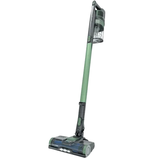 Cordless upright vacuum cleaner with a slim, lightweight design and transparent dustbin atop a long handle.