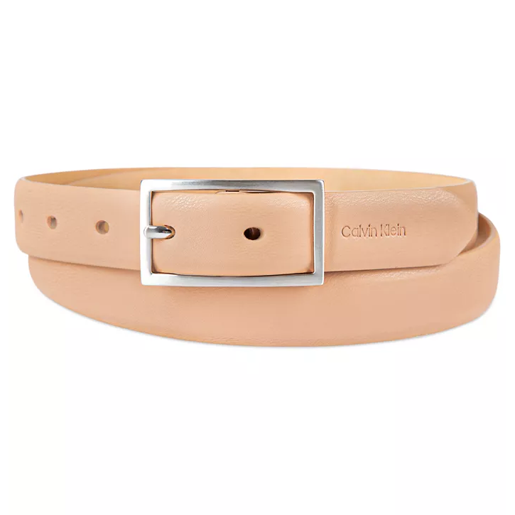A beige leather belt with a rectangular silver buckle, featuring the Calvin Klein logo embossed on the strap.