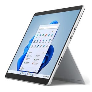 A modern tablet with a kickstand, displaying a colorful user interface with app icons.