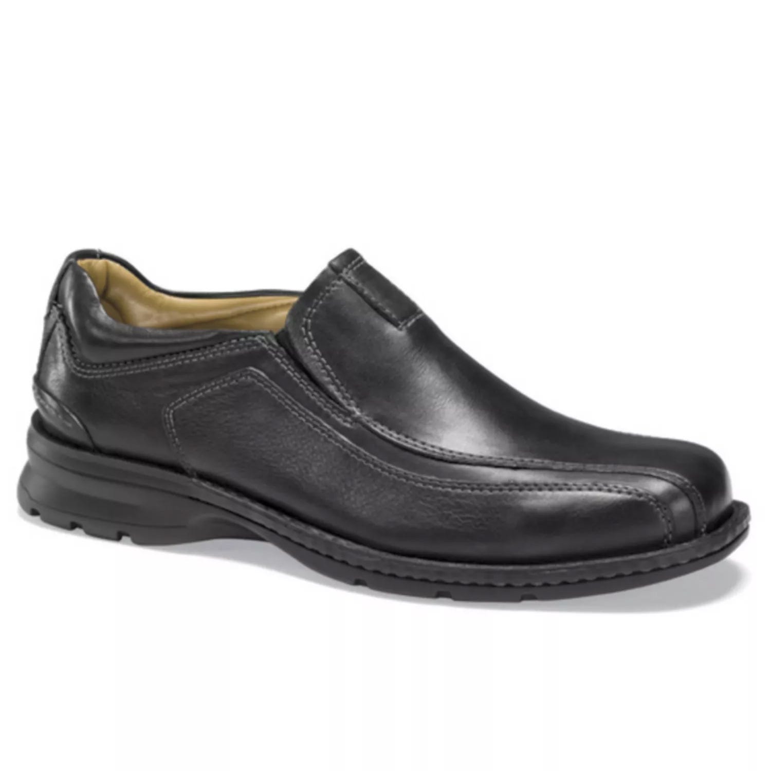 Black leather slip-on dress shoe with a rounded toe and cushioned sole, featuring visible stitching for added design detail.