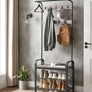 A metal coat rack with hooks, shelves, and storage bench, displaying a coat, backpack, shoes, and a plant.