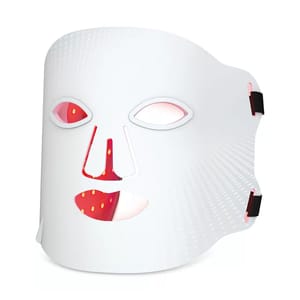 A white LED light therapy face mask with red light detailing and cutouts for the eyes, nose, and mouth.