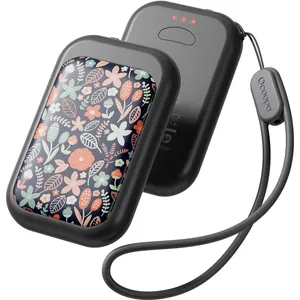 A compact, floral-patterned electric hand warmer with a grey frame, featuring dual units, LED indicators, and an attached strap.