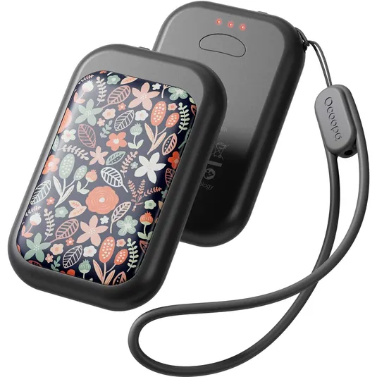 A compact, floral-patterned electric hand warmer with a grey frame, featuring dual units, LED indicators, and an attached strap.