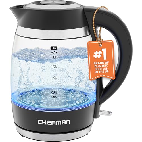 A clear glass and black plastic electric kettle with water level marks, a blue illumination feature, and a Chefman brand logo on it.