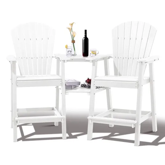 A white, tall Adirondack-style chair set with a built-in table, featuring a wine bottle, glass, vase with flowers, and a tray with cherries, suitable for outdoor use.