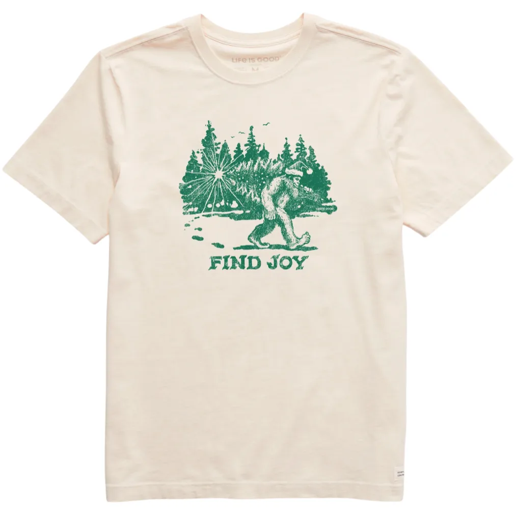 A beige T-shirt features a green graphic of Bigfoot walking in a forest with the text \“FIND JOY\“ below.