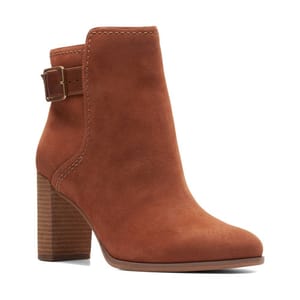 Brown suede ankle boot with a block heel and a side buckle detail.