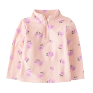 A peach-colored fleece pullover with a high collar and quarter-zip, featuring a floral pattern of purple flowers and green leaves.