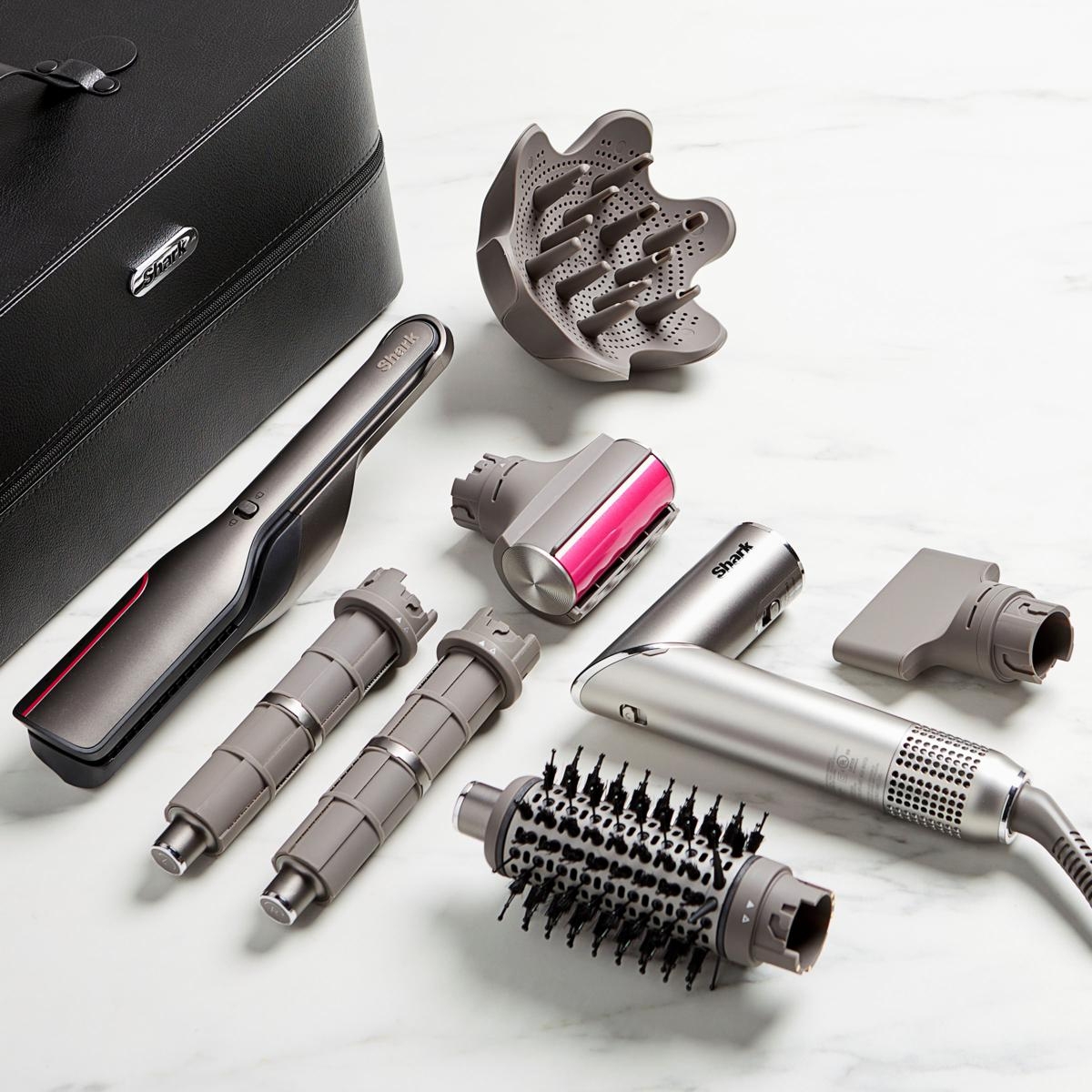 The Shark FlexFusion 5-in-1 Multi-Styler includes a main handle and attachments such as a round brush, straightening brush, diffuser, and concentrator, all housed in a sleek carrying case.