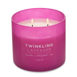 A pink Colonial Candle labeled \“Twinkling Lavender,\“ scented with lavender, violet petals, and sage. It has three wicks and weighs 14.5 oz (411g).