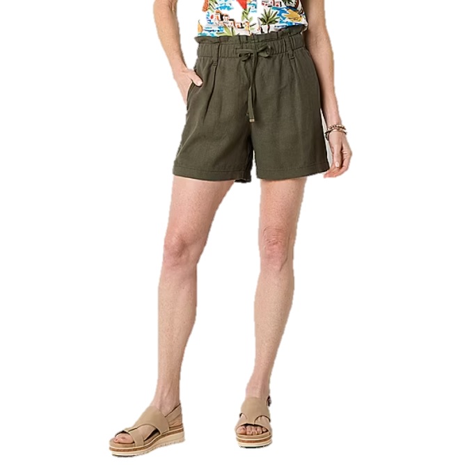 High-waisted green shorts with a drawstring tie and a paperbag waist, paired with tan wedge sandals and a colorful printed top.
