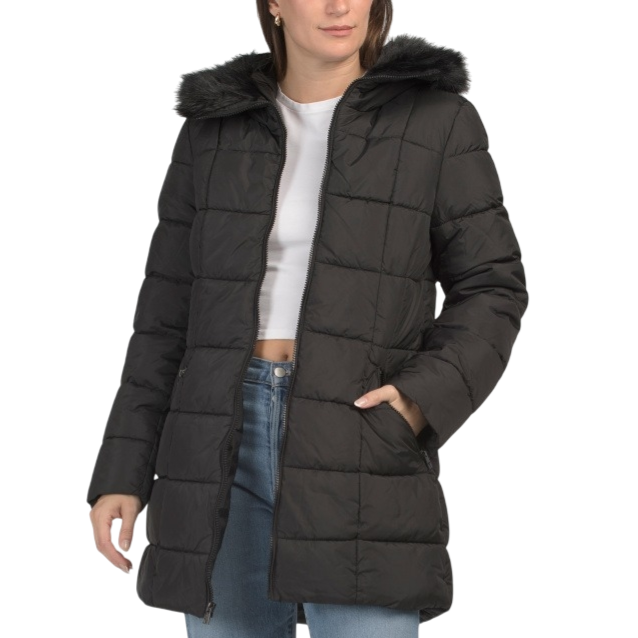 A black, quilted puffer coat with a faux fur-lined hood, worn over a white crop top and blue jeans.