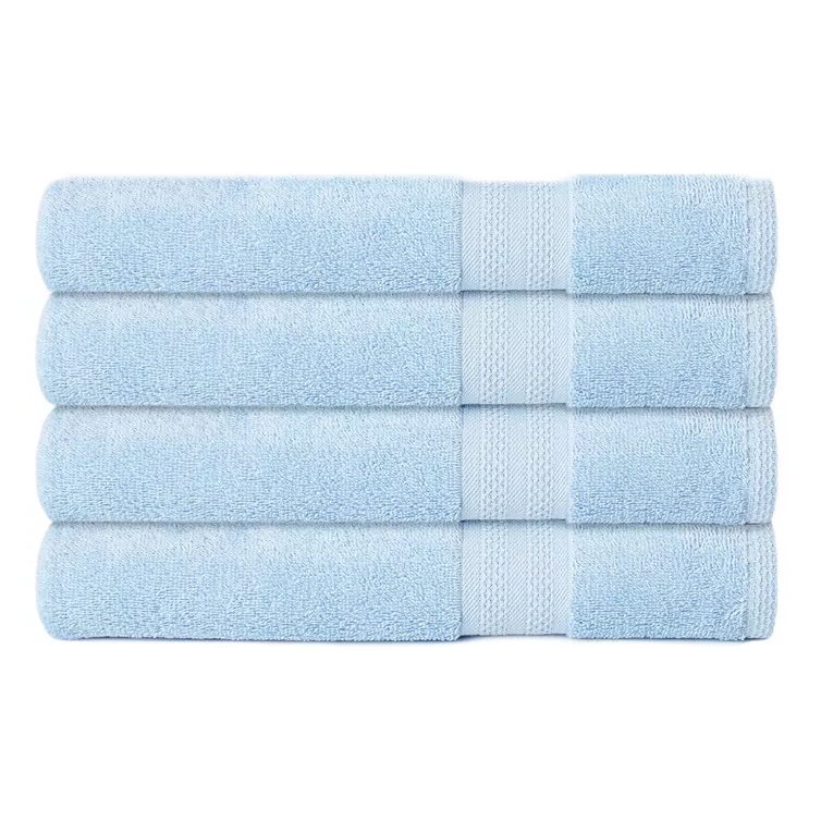 A stack of four light blue bath towels with a simple border design.