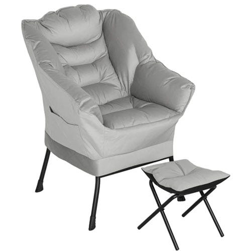 A grey padded chair with armrests and a matching foldable footstool, both featuring black legs.
