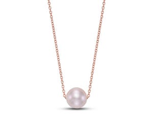 A delicate rose gold chain necklace with a single pearl pendant.