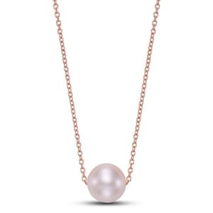 A delicate rose gold chain necklace with a single pearl pendant.