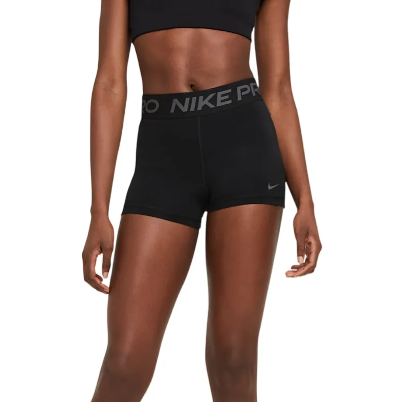 Black Nike Pro shorts with \“NIKE PRO\“ waistband, worn with a black sports bra and black Nike sneakers.
