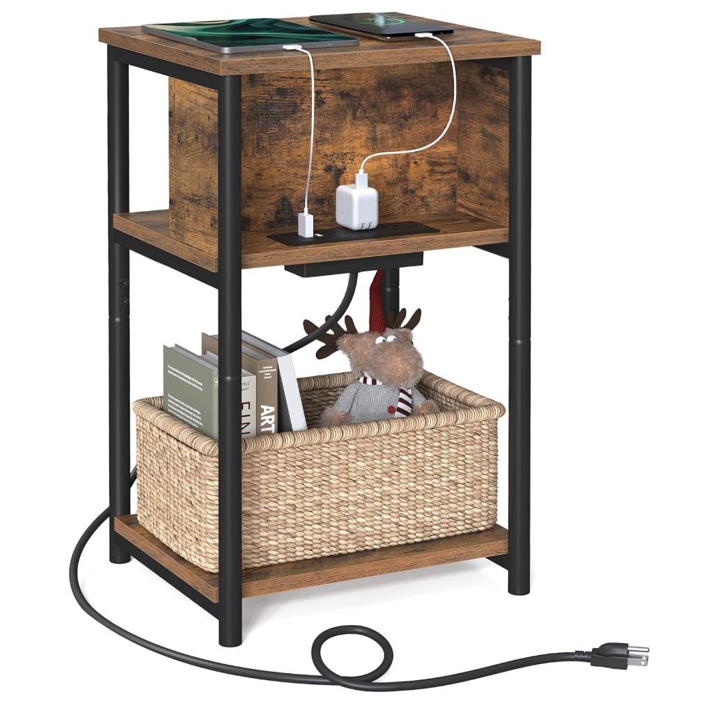 A compact side table with a rustic wood finish and black metal frame, featuring a charging station with USB ports and outlets. Includes a lower shelf with a woven basket for storage of books and decorative items.
