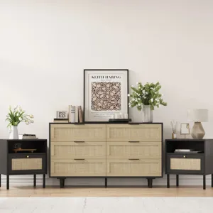 Mid-century style setup with a large dresser and two matching side tables featuring woven rattan drawer fronts and black accents. Decor includes a Keith Haring artwork, books, candles, a lamp, and vases with flowers.