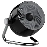 A black and silver tabletop fan with a circular design, featuring a tiltable head for adjustable airflow and a sturdy metal frame.
