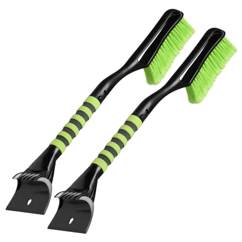 Two snow brushes with green bristles and black handles, featuring rubber grip sections for handling, and ice scrapers on the opposite ends.