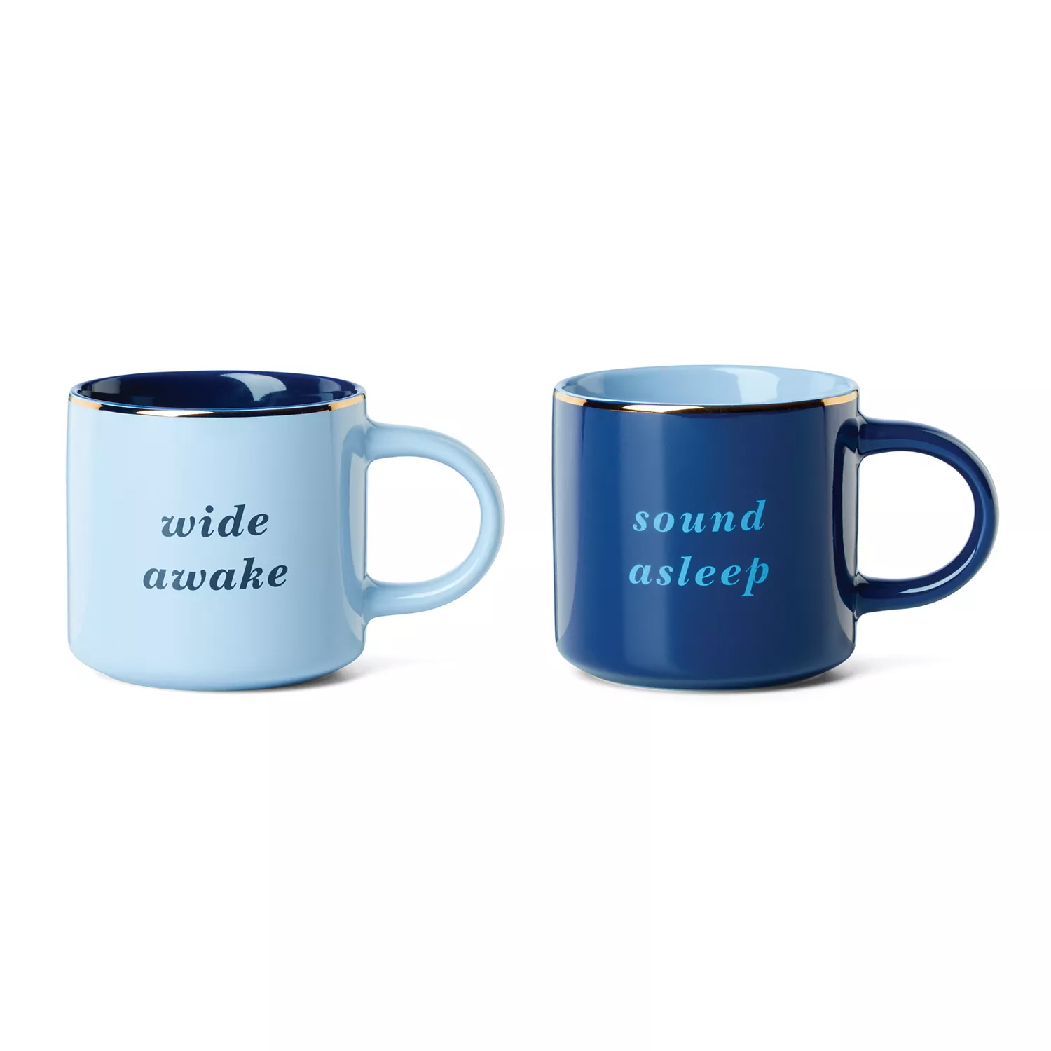 Two ceramic mugs: one light blue with \“wide awake\“ and one dark blue with \“sound asleep,\“ both featuring gold accents.