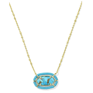 A gold chain necklace featuring an oval-shaped, turquoise magnesite stone with gold-tone prongs, surrounded by a beaded trim.