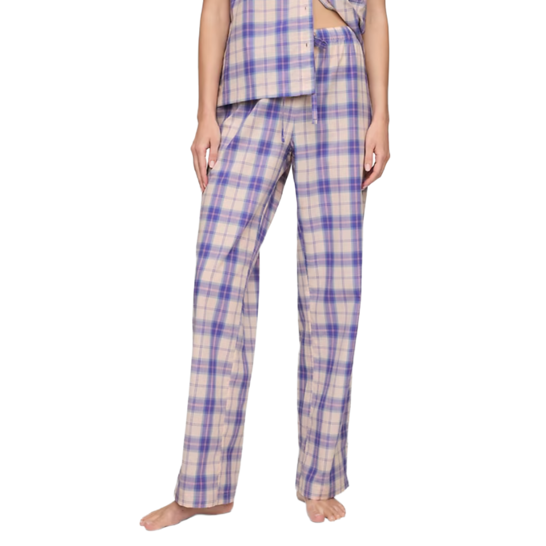 Plaid pajama pants with shades of blue and beige, featuring a loose fit and drawstring waist.