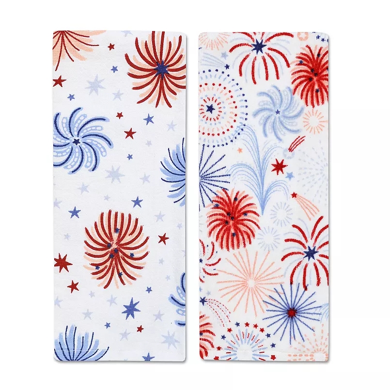 Two white towels featuring red, white, and blue fireworks and star patterns, suitable for festive occasions or patriotic themes.