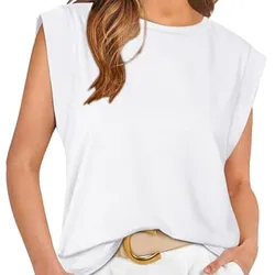 A woman wears a sleeveless white top with rolled cuffs, paired with light-colored pants and a wide belt featuring a large oval buckle.