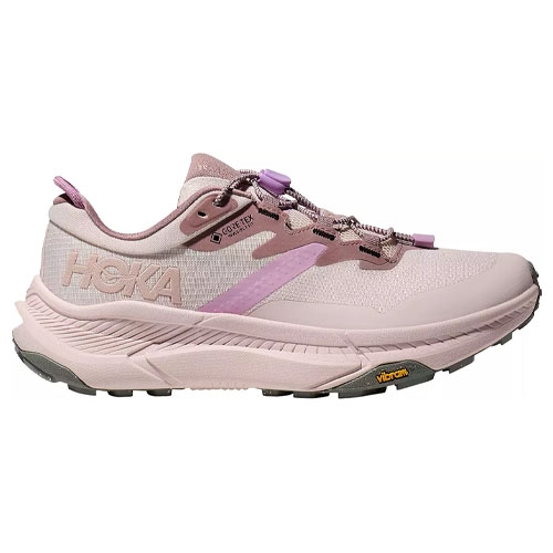 Pink HOKA sneaker with Gore-Tex and Vibram sole, featuring a breathable design and a cushioned midsole for comfort.