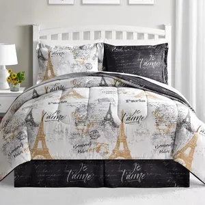 A bedding set with a Paris theme featuring designs of the Eiffel Tower and phrases like \“Je t'aime\“ and \“Bonjour Paris.\“ The color scheme includes black, white, and gold tones.