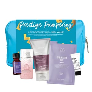 A collection of hair care items including a protective masque, silver hair mask, heat protectant spray, and other beauty products with a blue bag.