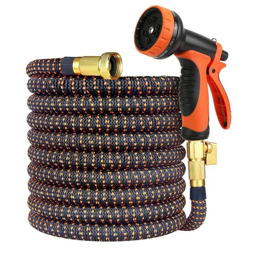 Expandable garden hose with an orange and black pattern, featuring brass connectors and an adjustable spray nozzle with multiple settings.