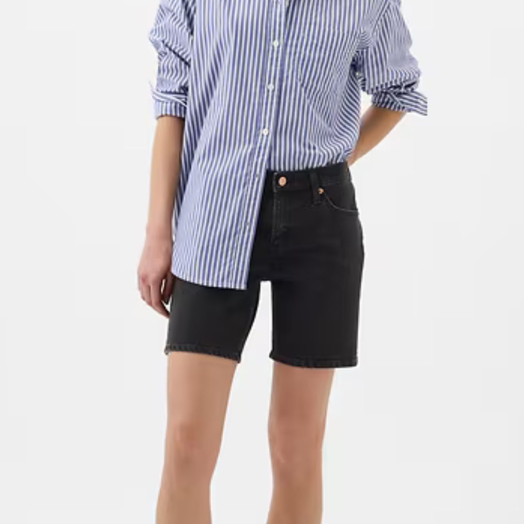 Black denim shorts with a frayed hem, featuring a button and zip closure and classic five-pocket design.