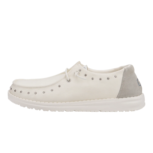 Wendy Star Studded Shoes are casual slip-ons featuring a white color with silver studs along the sides, light gray suede accents on the heel, and a white sole. They have lace detailing for added style.