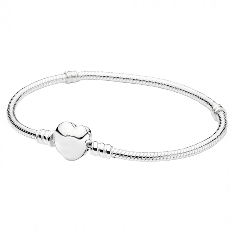 A sleek silver bracelet with a snake chain design, featuring a prominent heart-shaped clasp at its center.