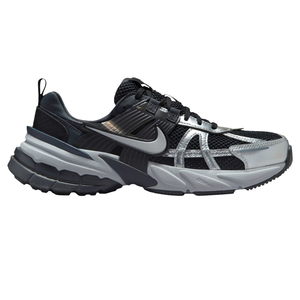 Black and silver Nike athletic shoe with mesh and synthetic materials, featuring a distinct swoosh logo and a thick sole for cushioning and support.