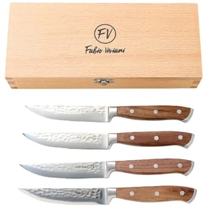 A set of four steak knives with wooden handles and serrated blades, accompanied by a wooden storage box labeled \“Fabio Viviani.\“