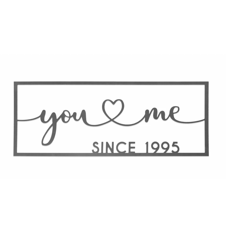 An 18\“ black steel sign featuring the text \“you ♥ me\“ connected with a heart, followed by \“SINCE 1995\“ in a rectangular frame, symbolizing a lasting relationship.