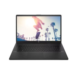 A laptop with a skateboarder on the screen and palm trees in the background.