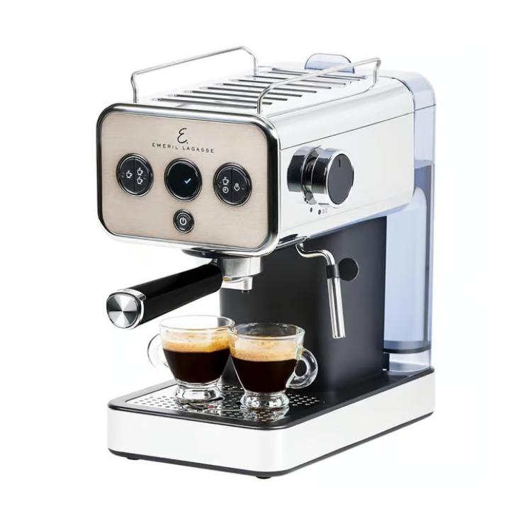 Emeril Lagasse espresso machine with dual spout, stainless steel finish, and a steam wand. Two small glass cups filled with espresso are placed under the portafilter.