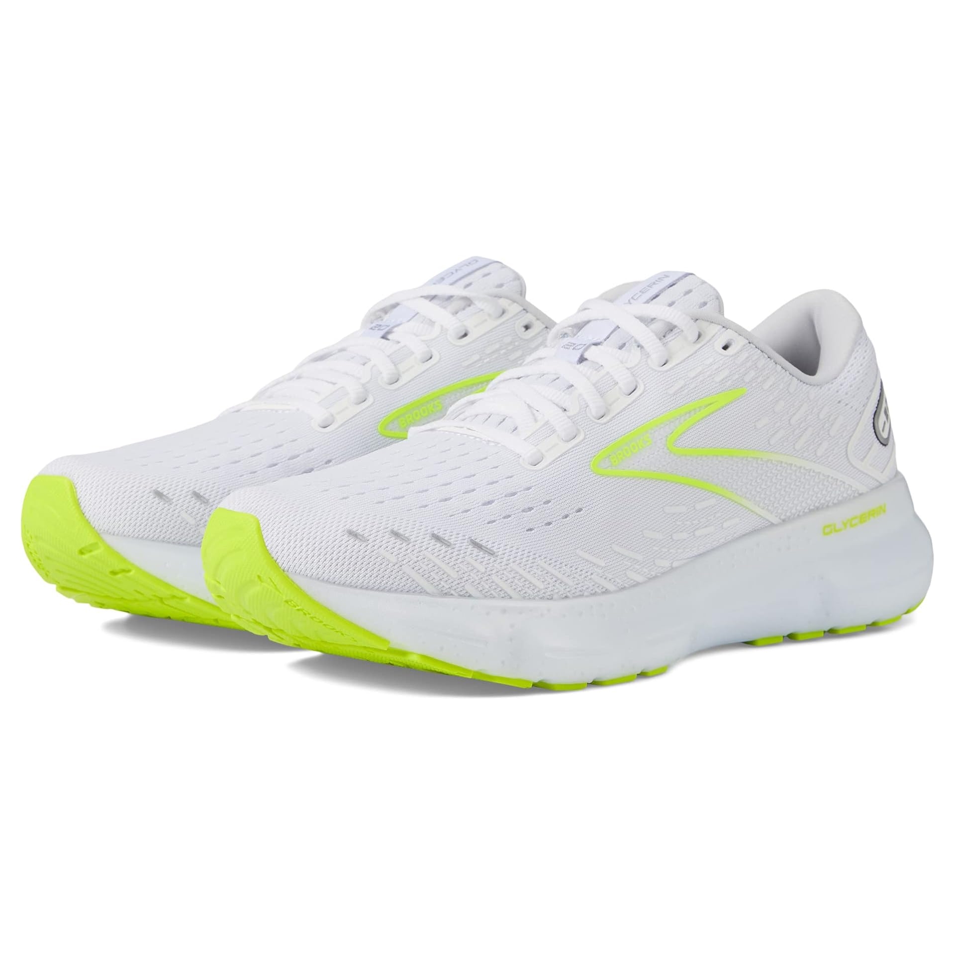 A pair of white running shoes with neon yellow accents and soles, featuring a cushioned design.